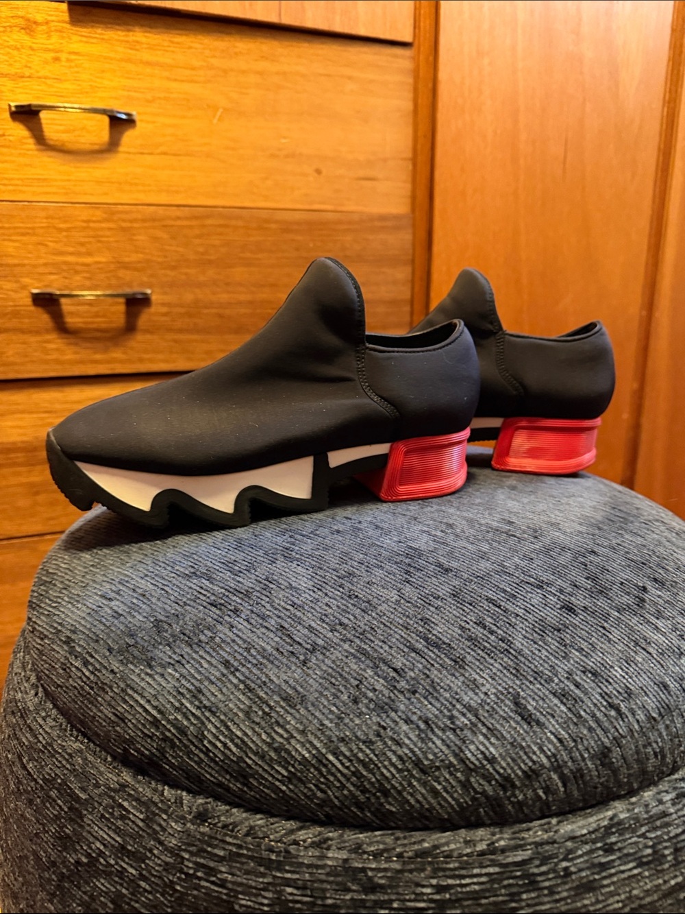 Womenโs Black Slip-On sneakers with Red Accent Heel